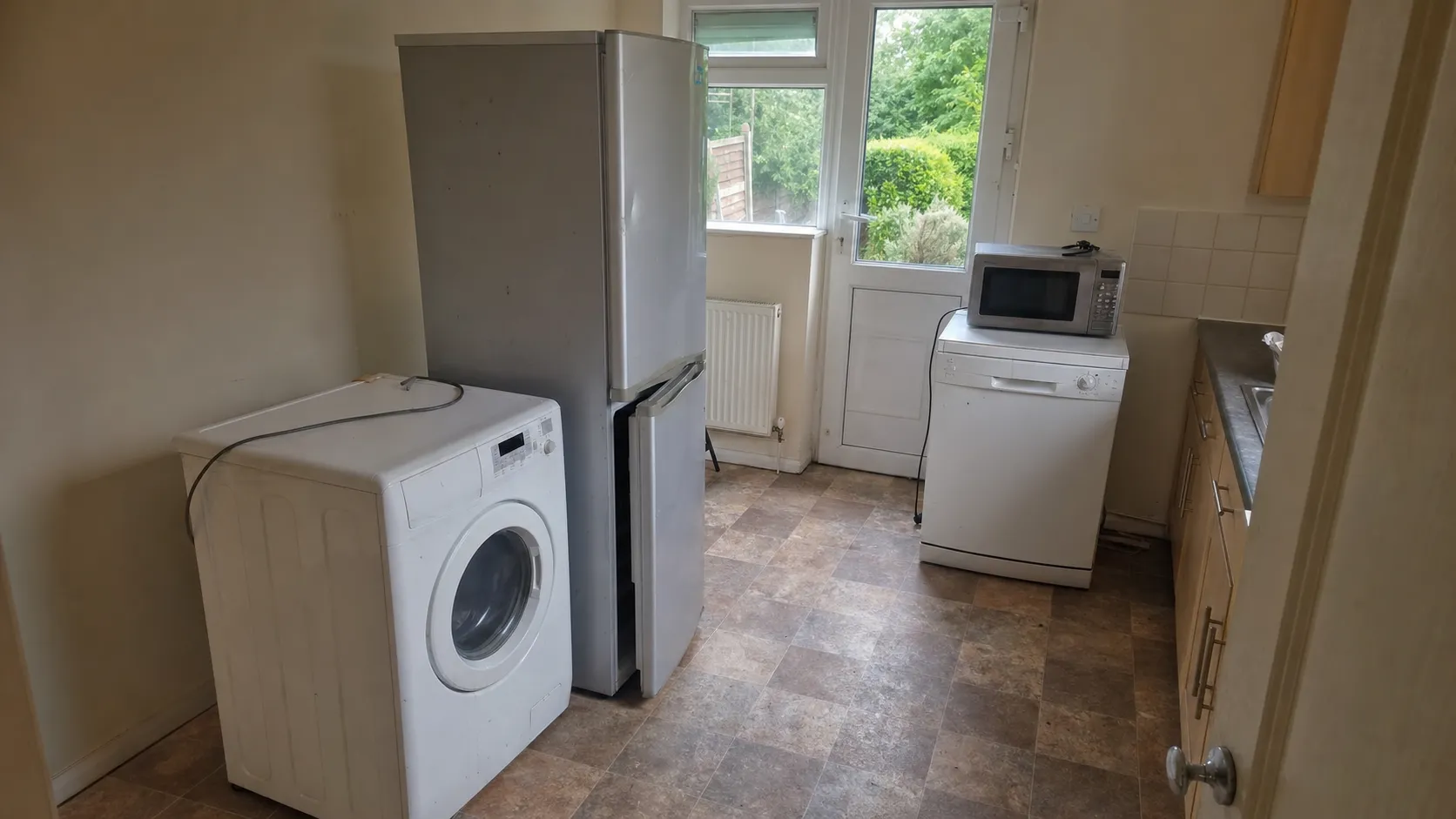 London kitchen before and after Oxload appliance removal — before