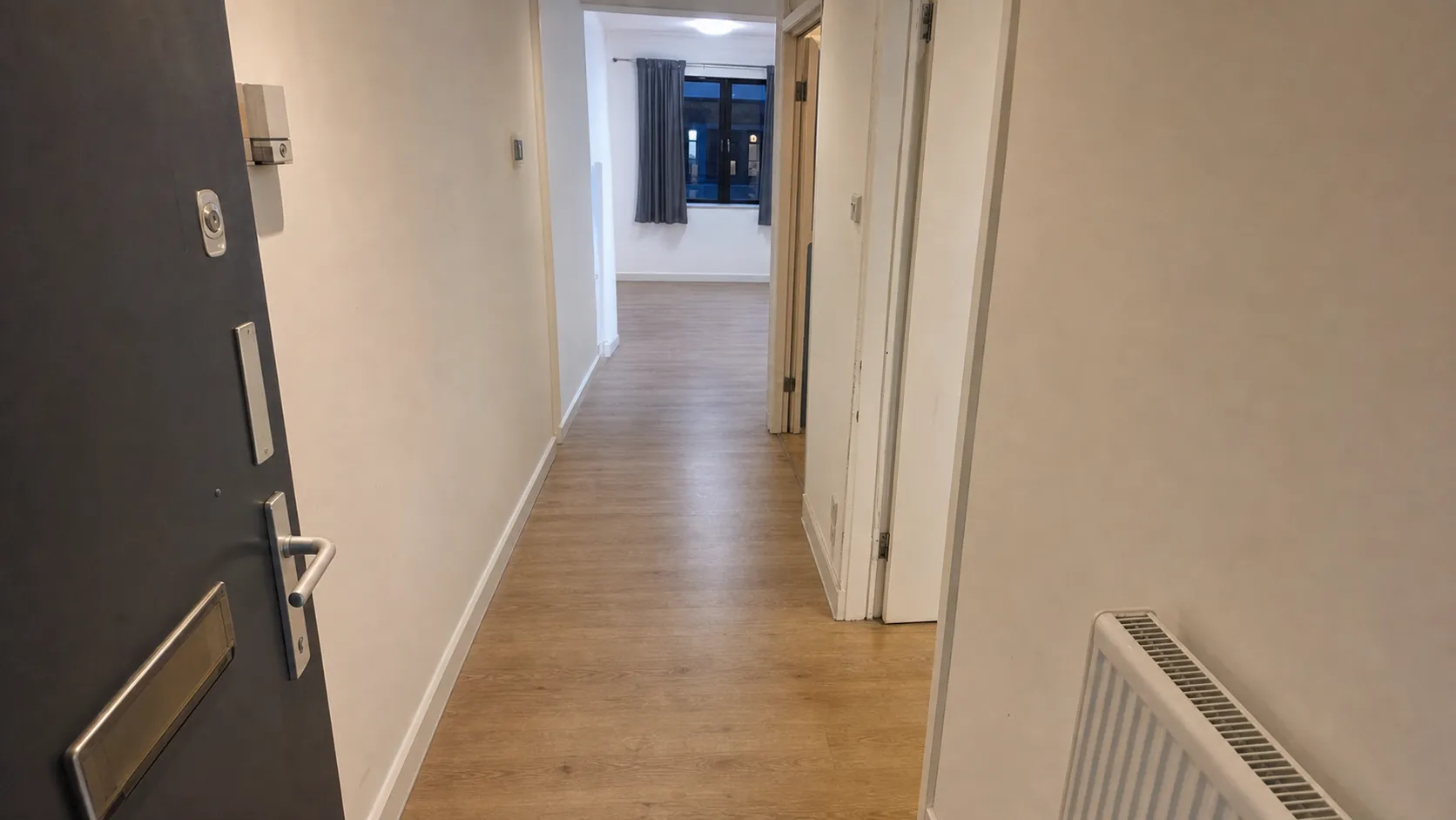 London flat hallway before and after Oxload clearance — after