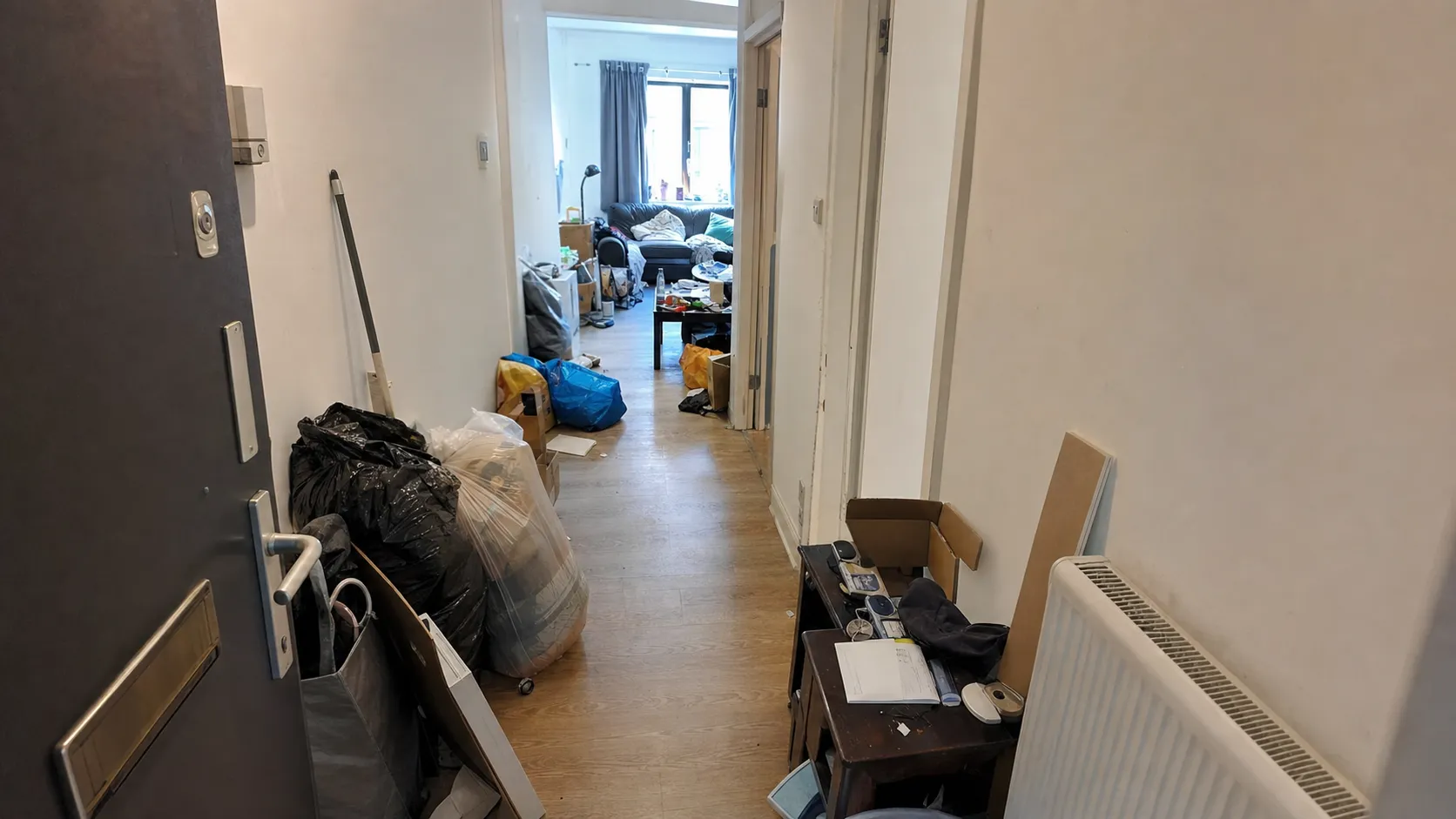 London flat hallway before and after Oxload clearance — before