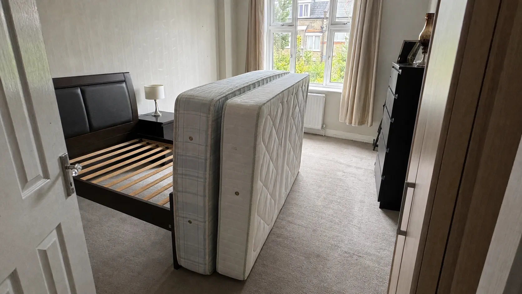 London bedroom before and after Oxload mattress removal — before