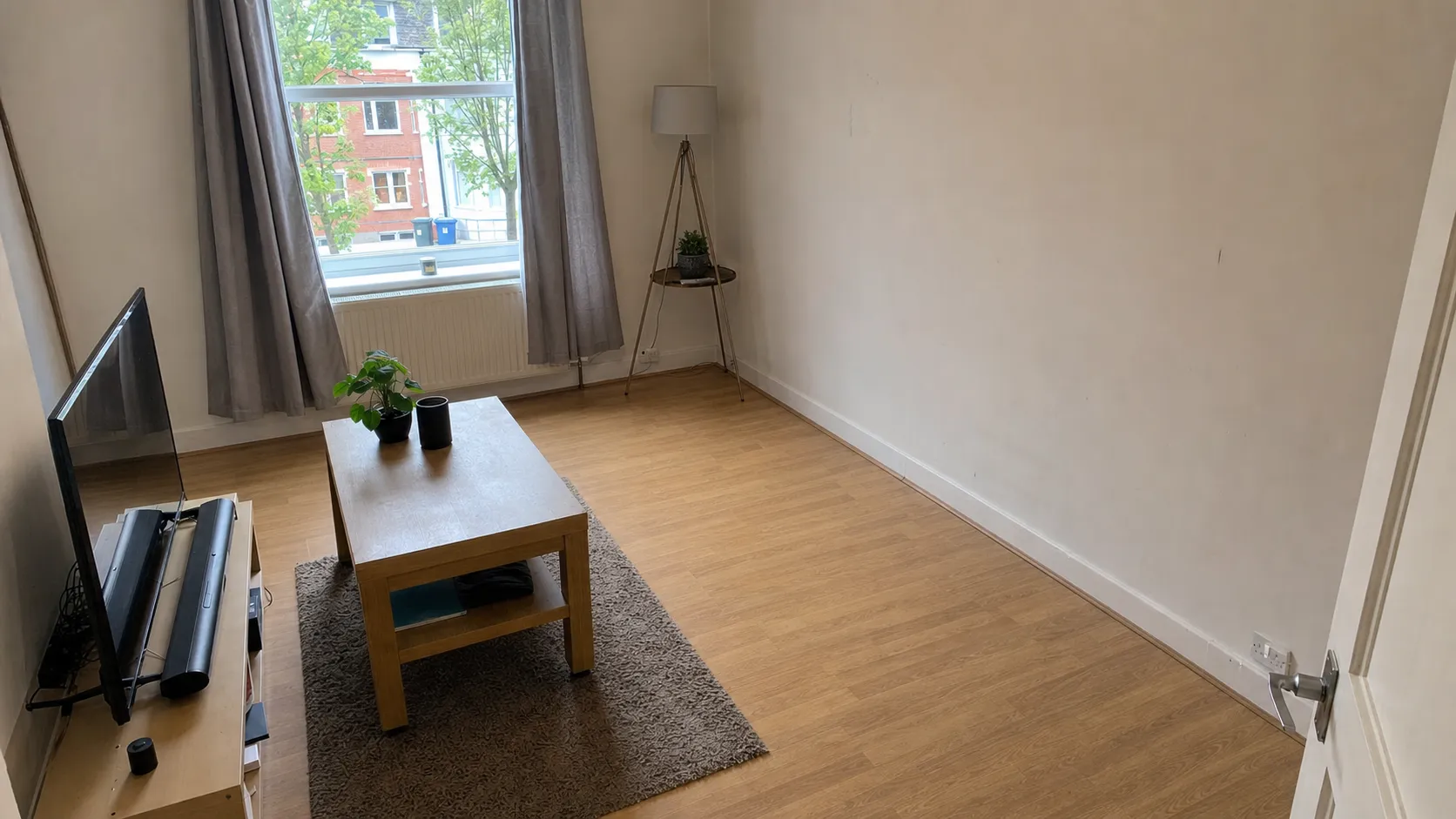 London living room before and after Oxload sofa removal — after