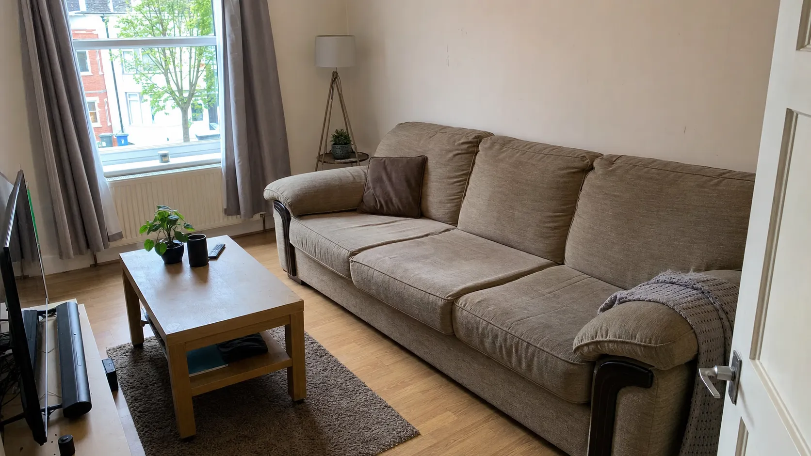 London living room before and after Oxload sofa removal — before